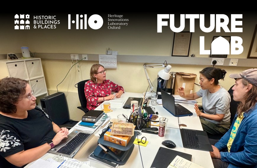 Image of 4 Future Lab project team members in a meeting together in an office space.